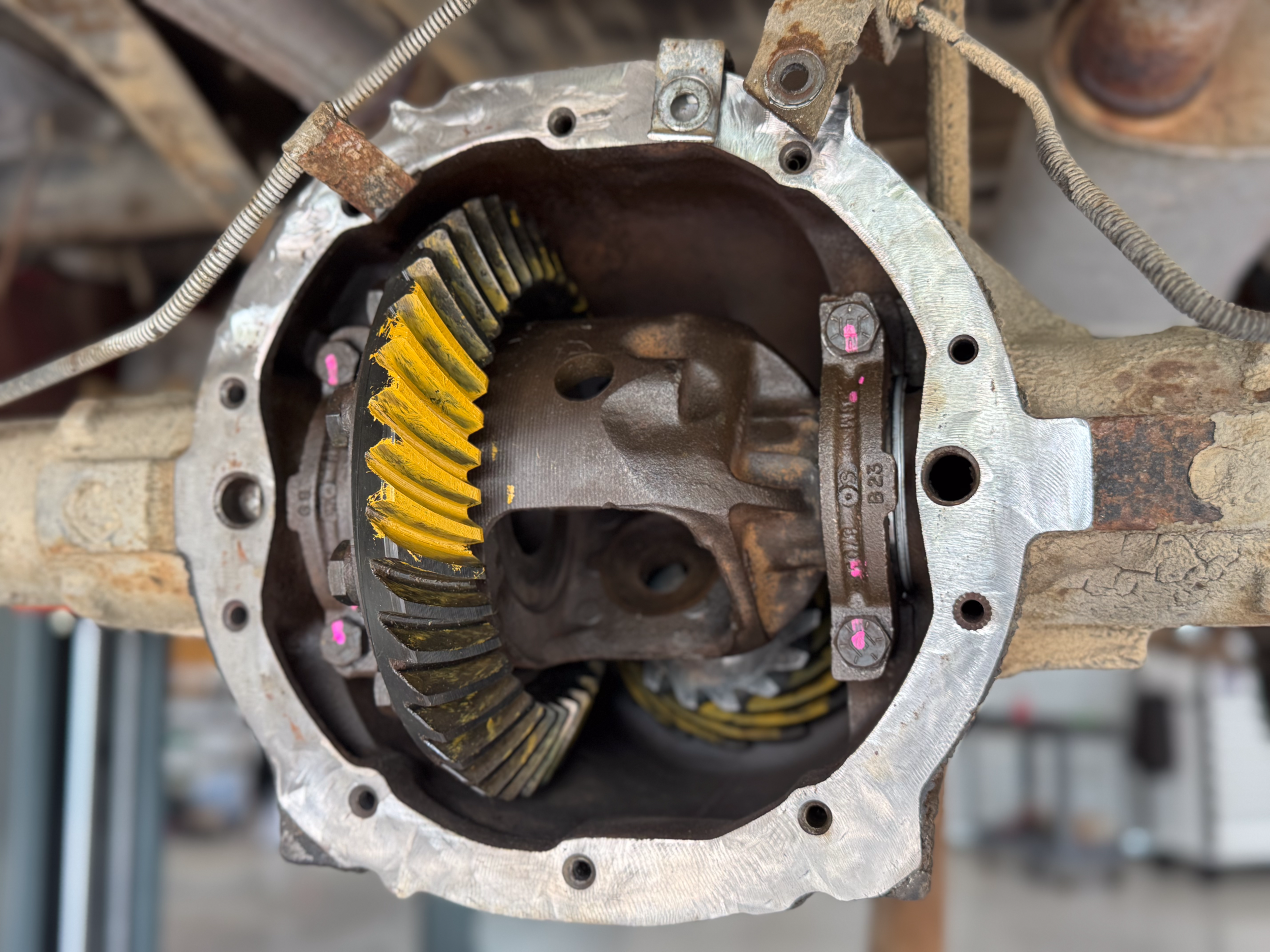 A photo of the gears inside of a rear differential marked with pait to measure pinion lash